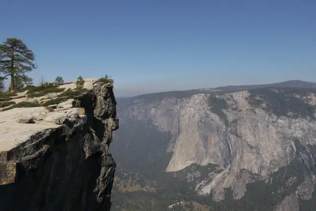 A jutting granite overhang on the left, the sheer face of El Capitan across the valley.