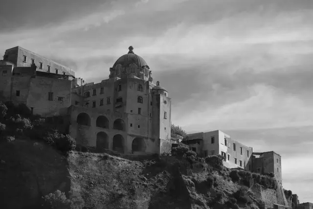 The domed cathedral and buildings along the top of the Castello.