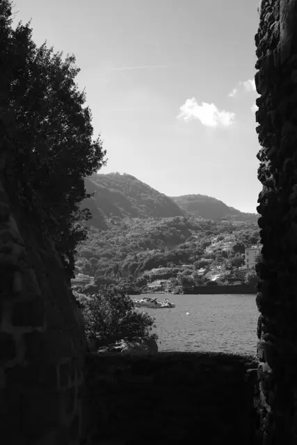 Hills and the bay seen through a gap in the Castello's walls.