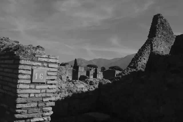 The same brick pillar numbered 16, in black and white.